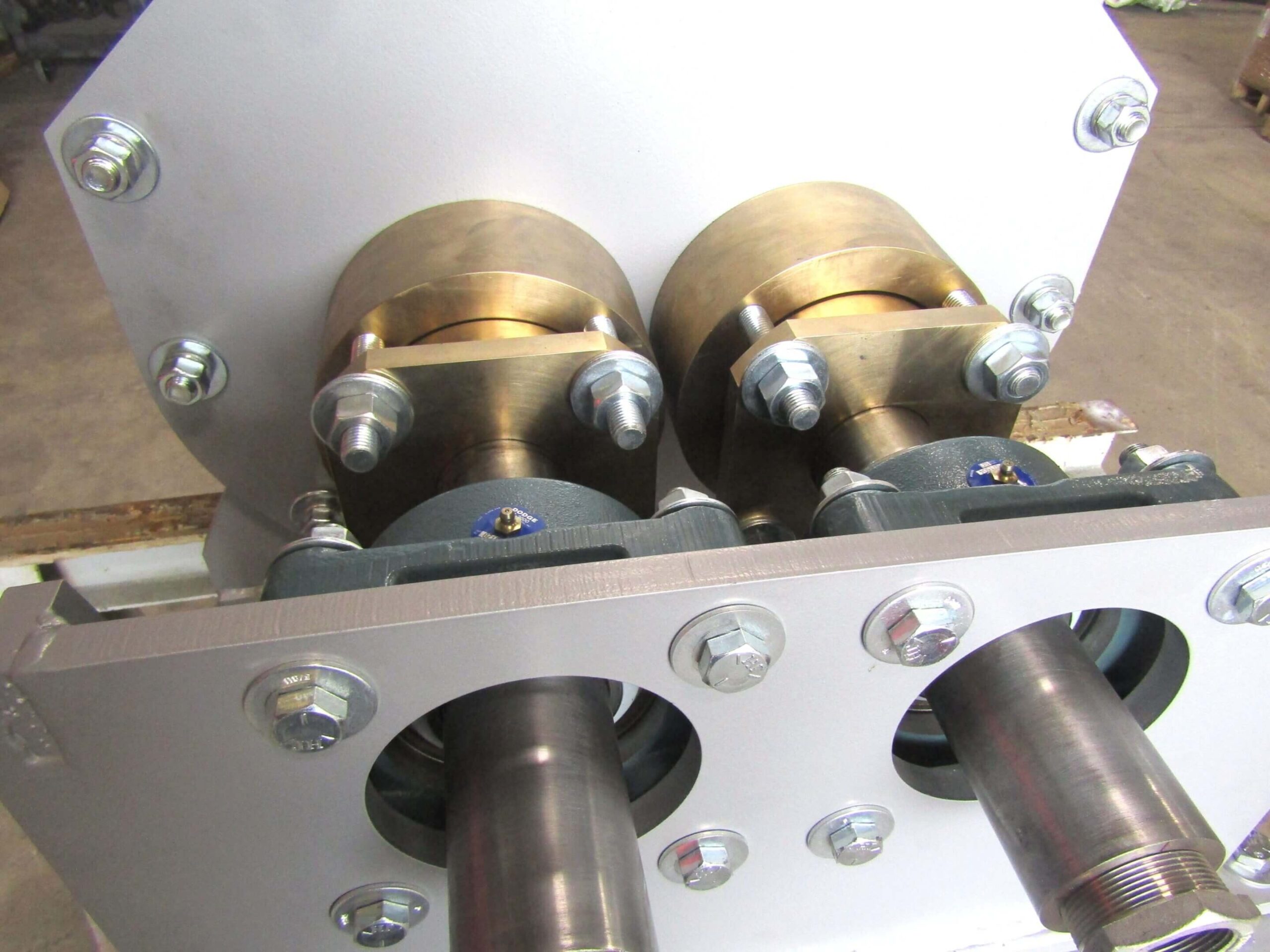 Close-up of a mechanical assembly with metal shafts and bolts.